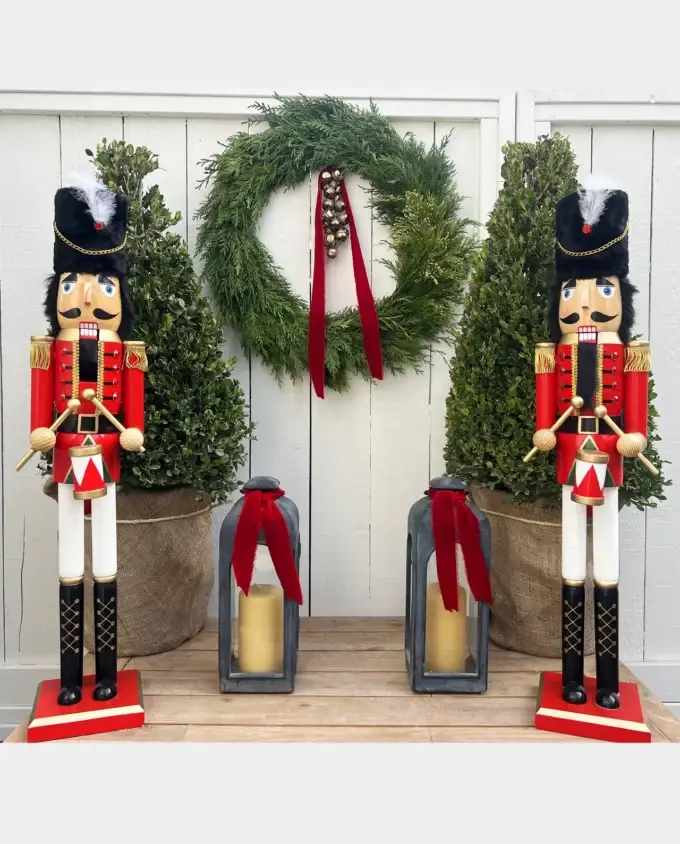 cedar-holiday-wreath-red-ribbon-sleigh-bells-nutcrackers